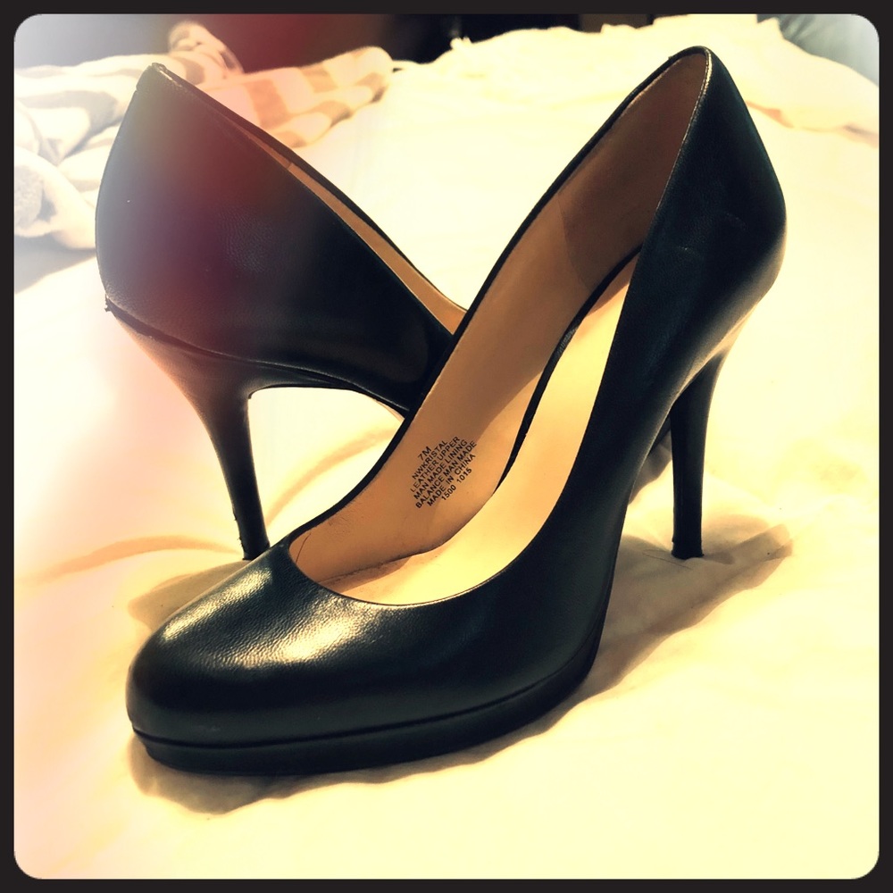 Black leather one west pumps.